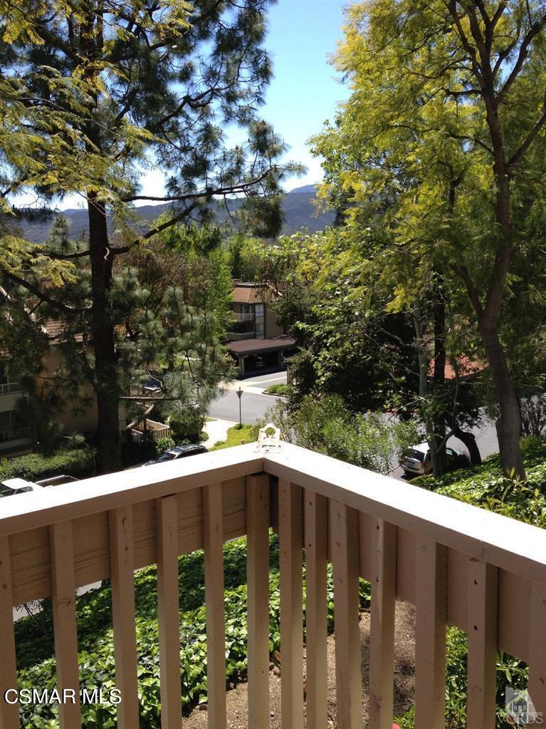 a view of a street from a balcony