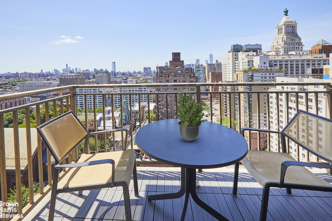 a view of a chairs and table on the deck