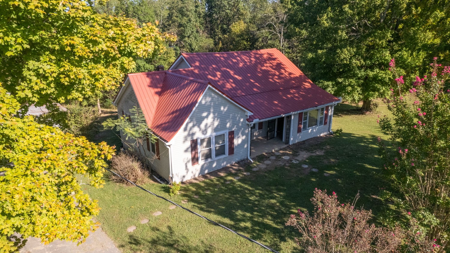 a aerial view of a house with a yard