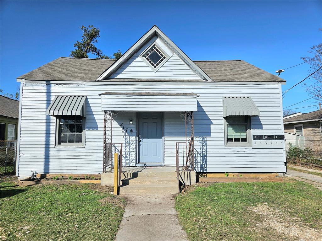 a front view of a house with garage