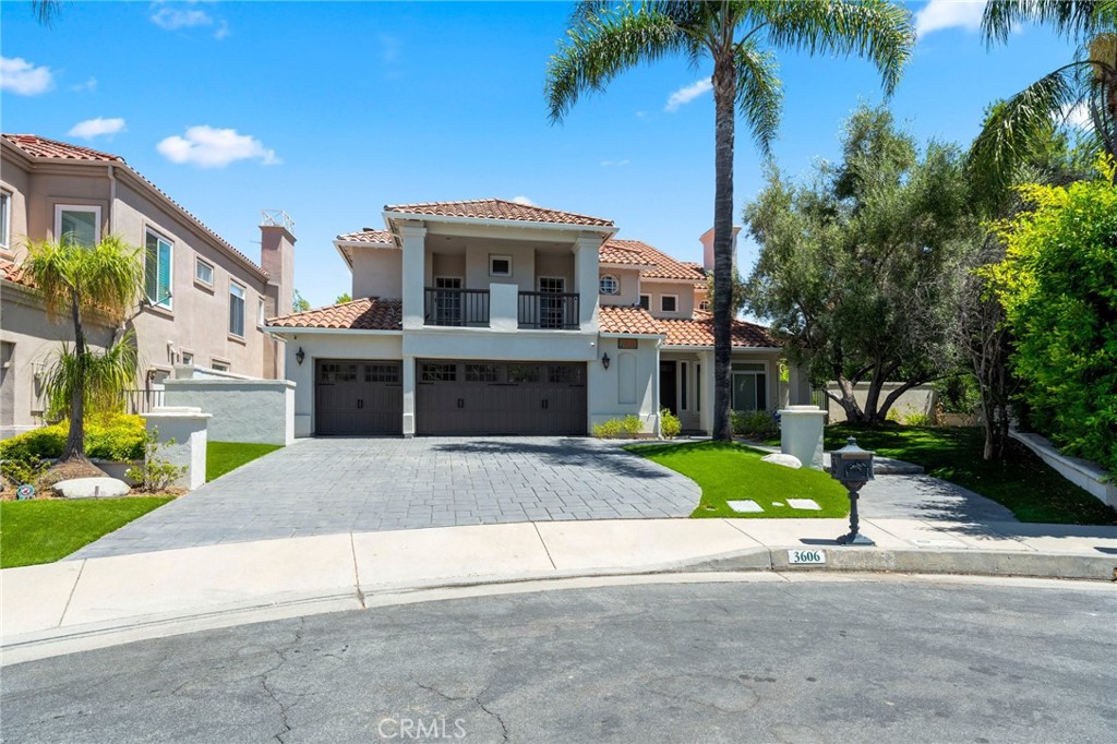 a house with palm tree in front of it