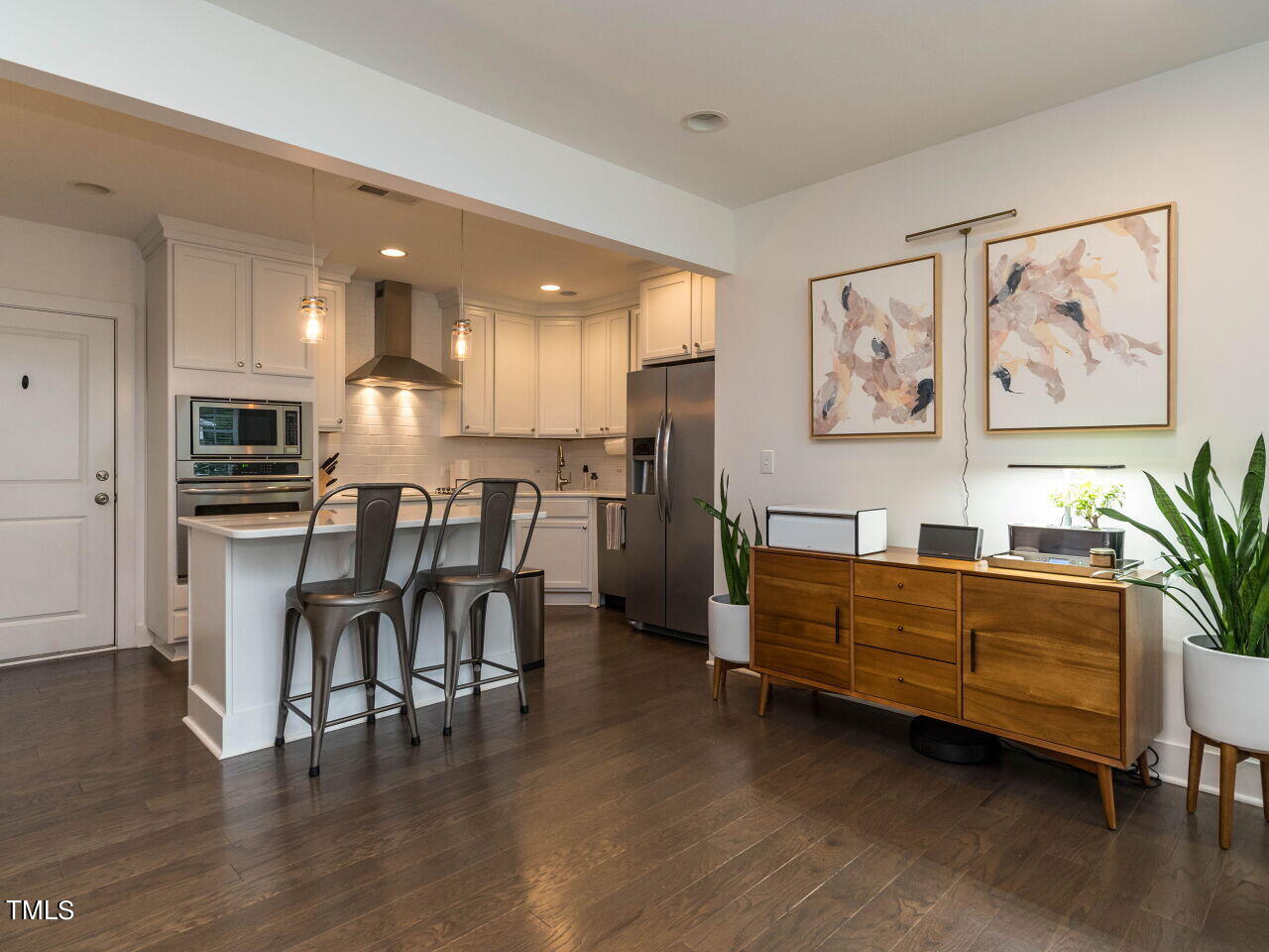 a view of kitchen with cabinets and furniture