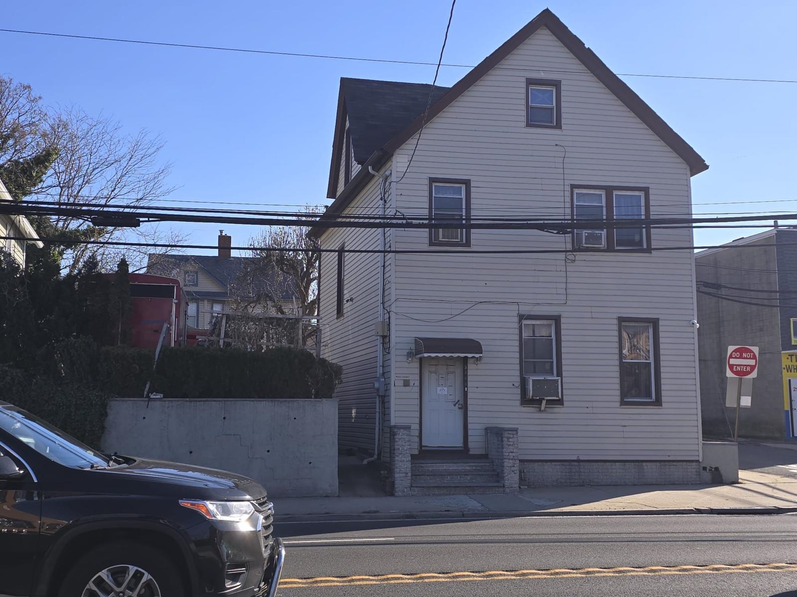 a view of a house with a street