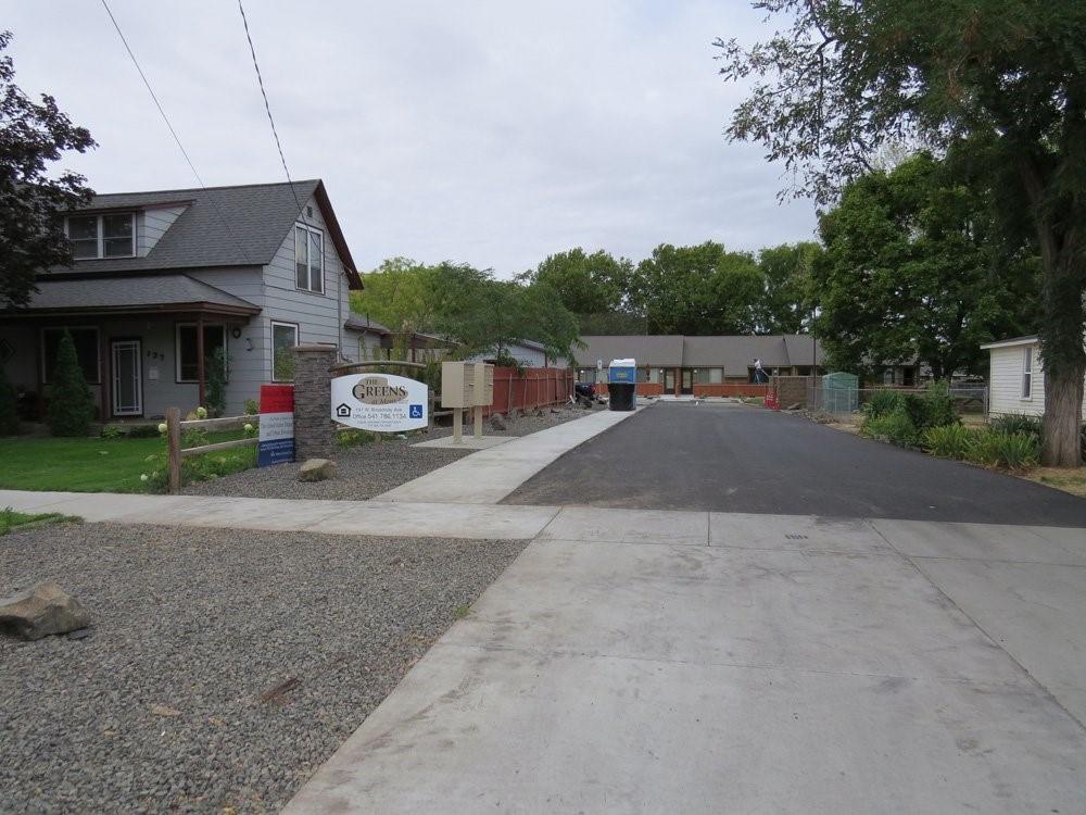 a view of a car park in front of house