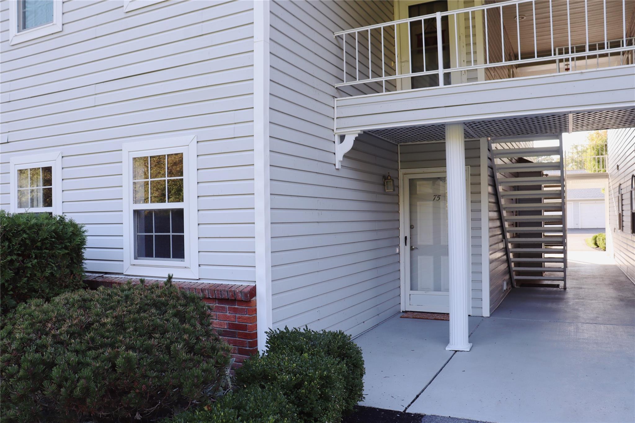 Doorway to property with a balcony