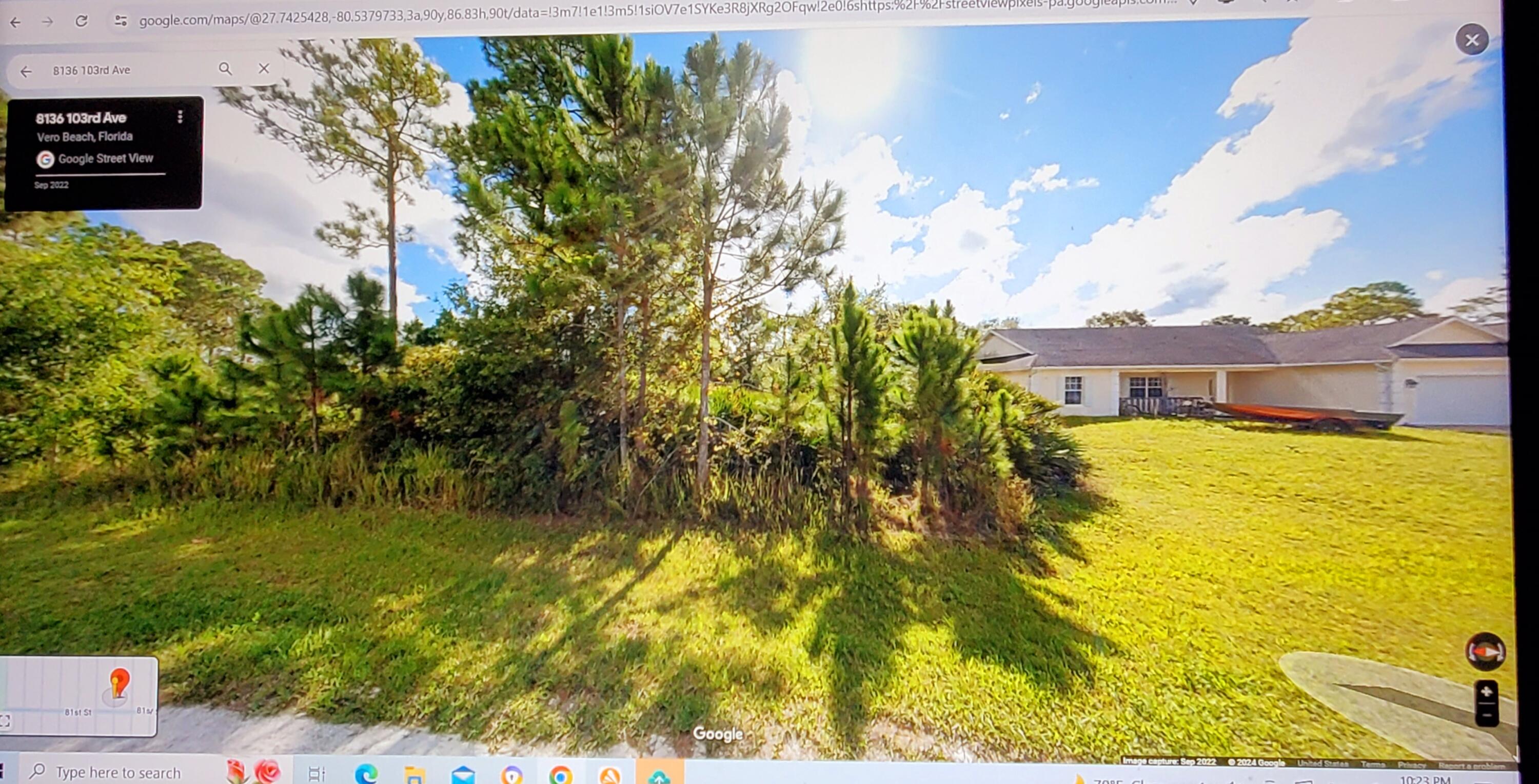 a view of a lake with a big yard