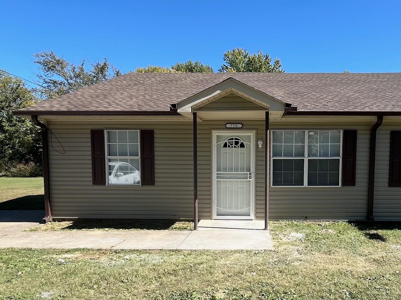 front view of a house with a yard