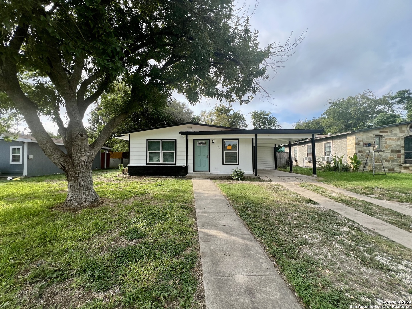 front view of a house with a yard