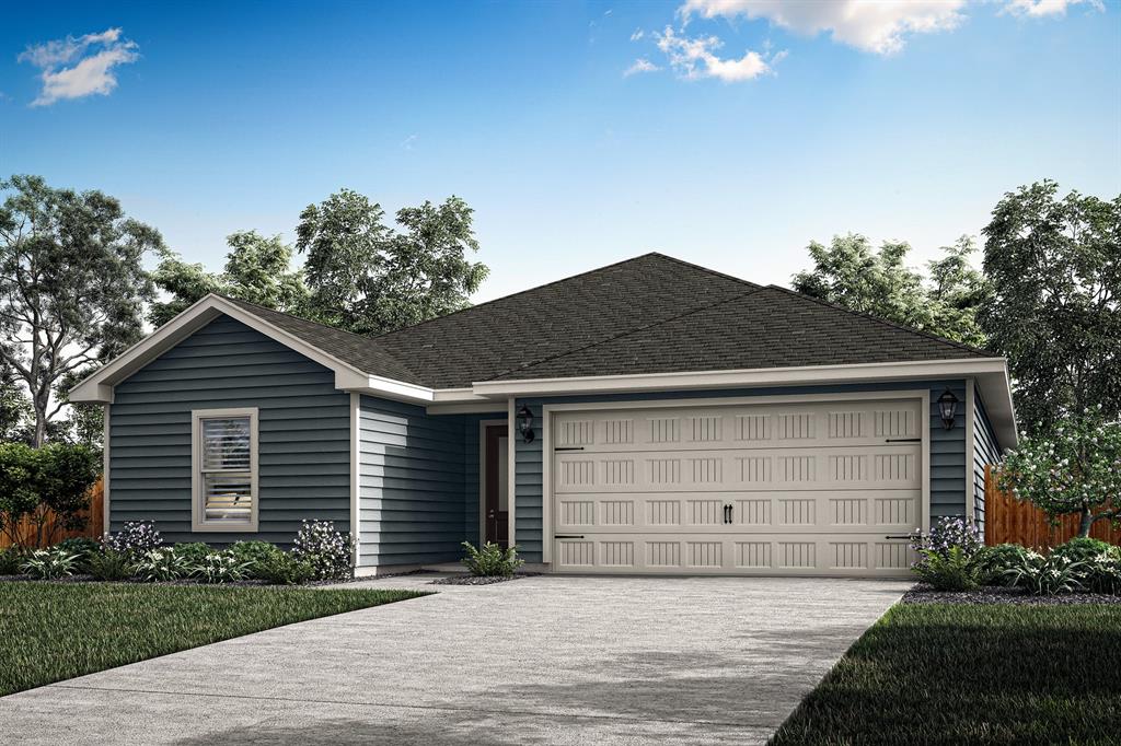 a front view of a house with a garden and garage