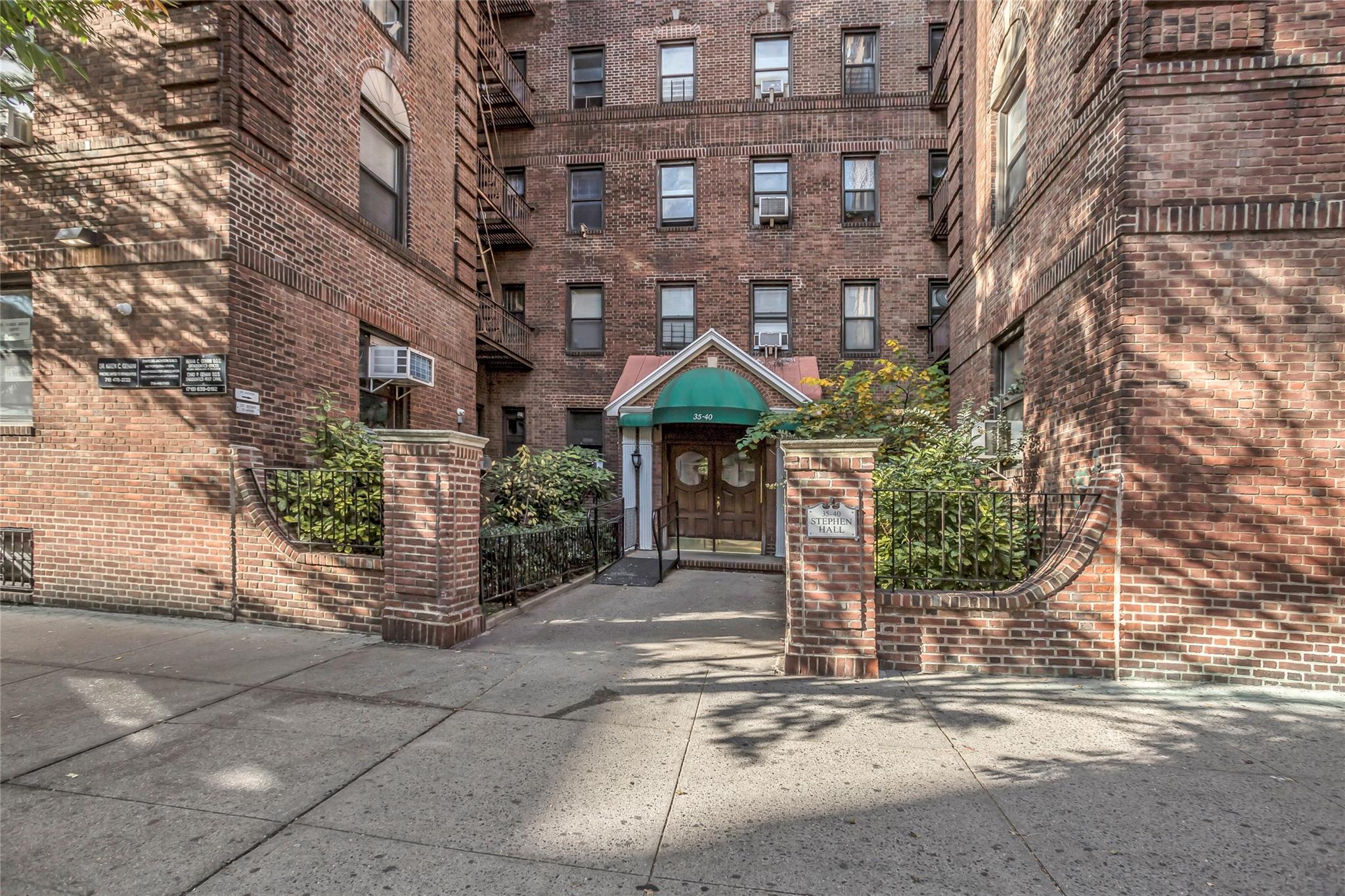 a front view of a building with street view