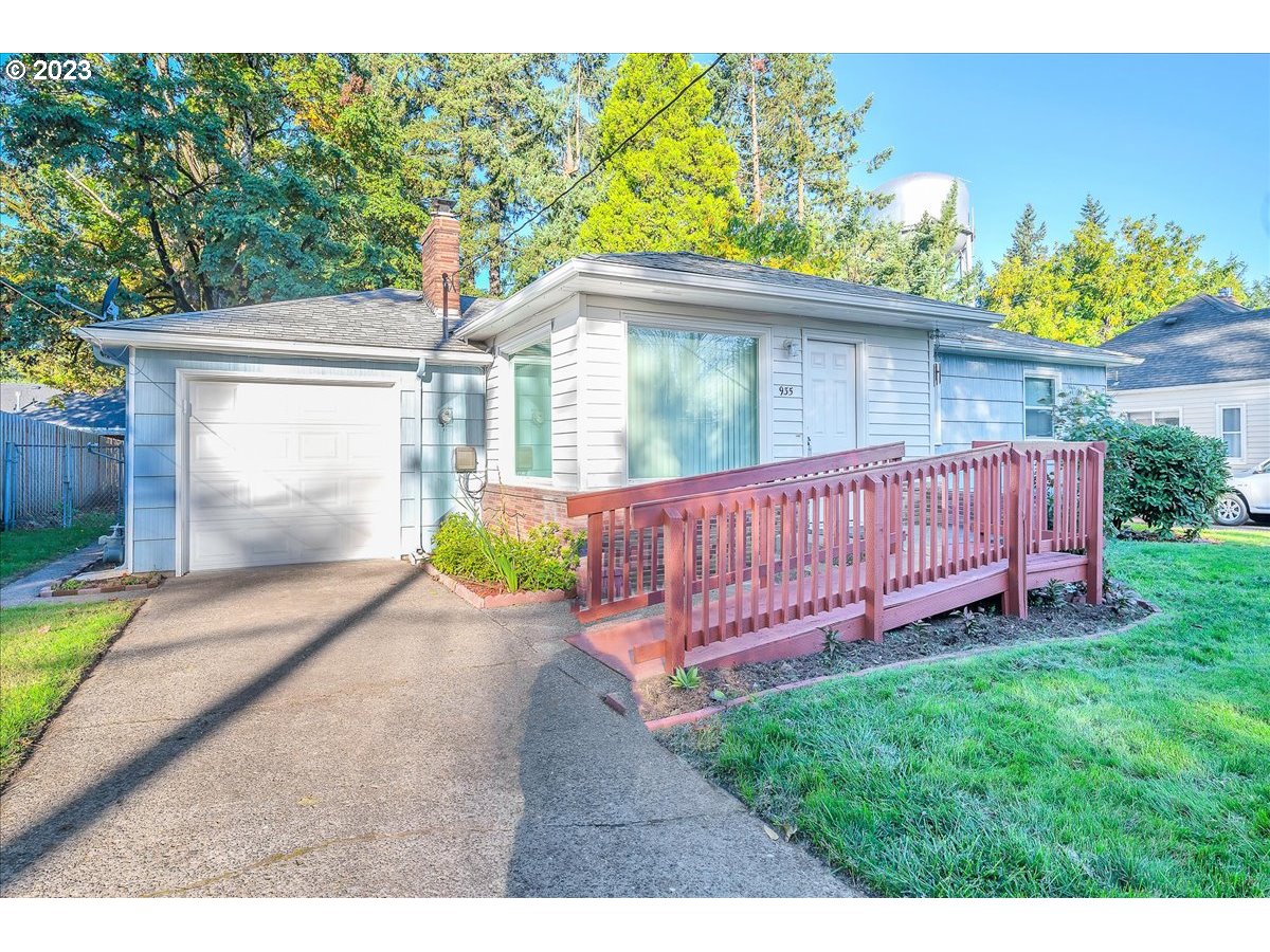 a view of a small yard with wooden fence