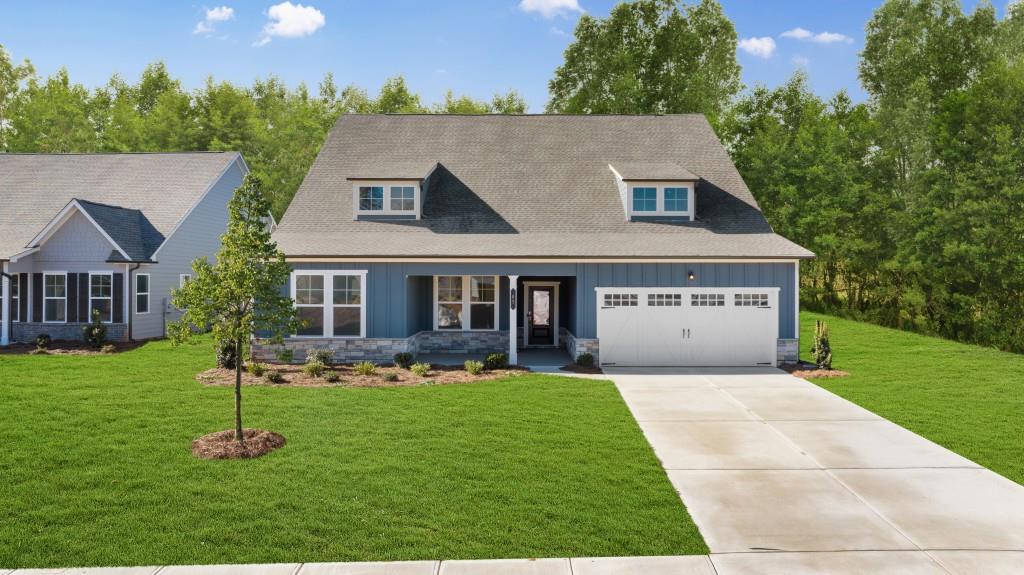 a aerial view of a house with a yard