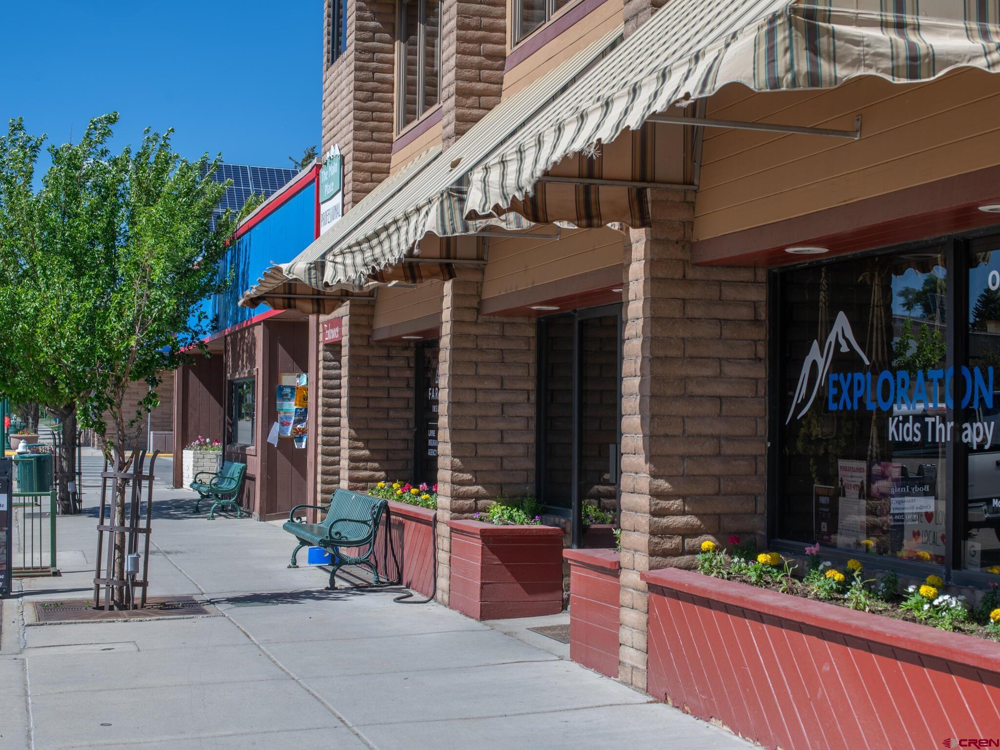 a view of a building with sitting area