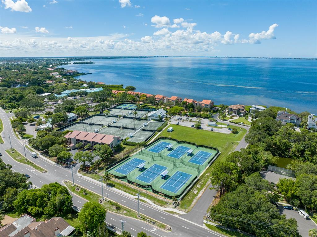 an aerial view of a residential houses with outdoor space