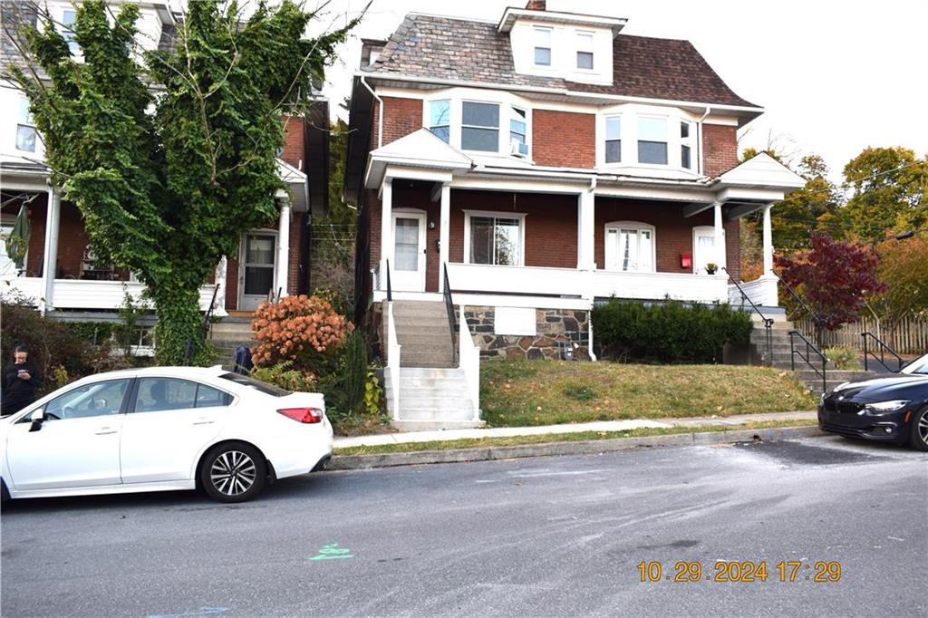 a car parked in front of a house