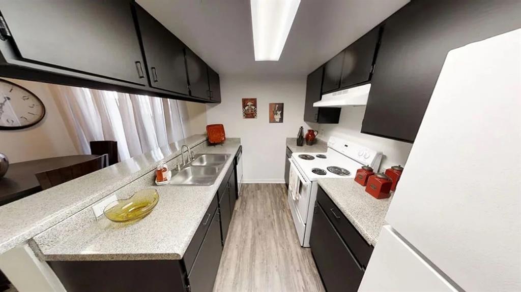 a kitchen with stainless steel appliances stove and cabinets