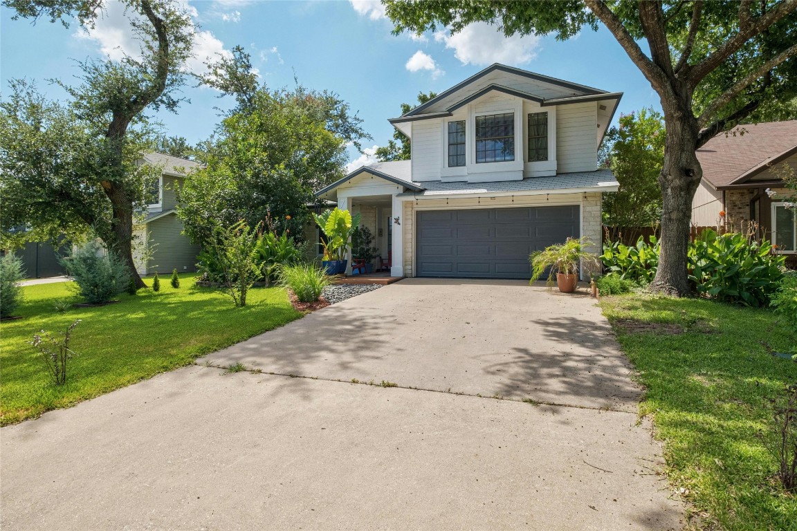 a house with garden in front of it