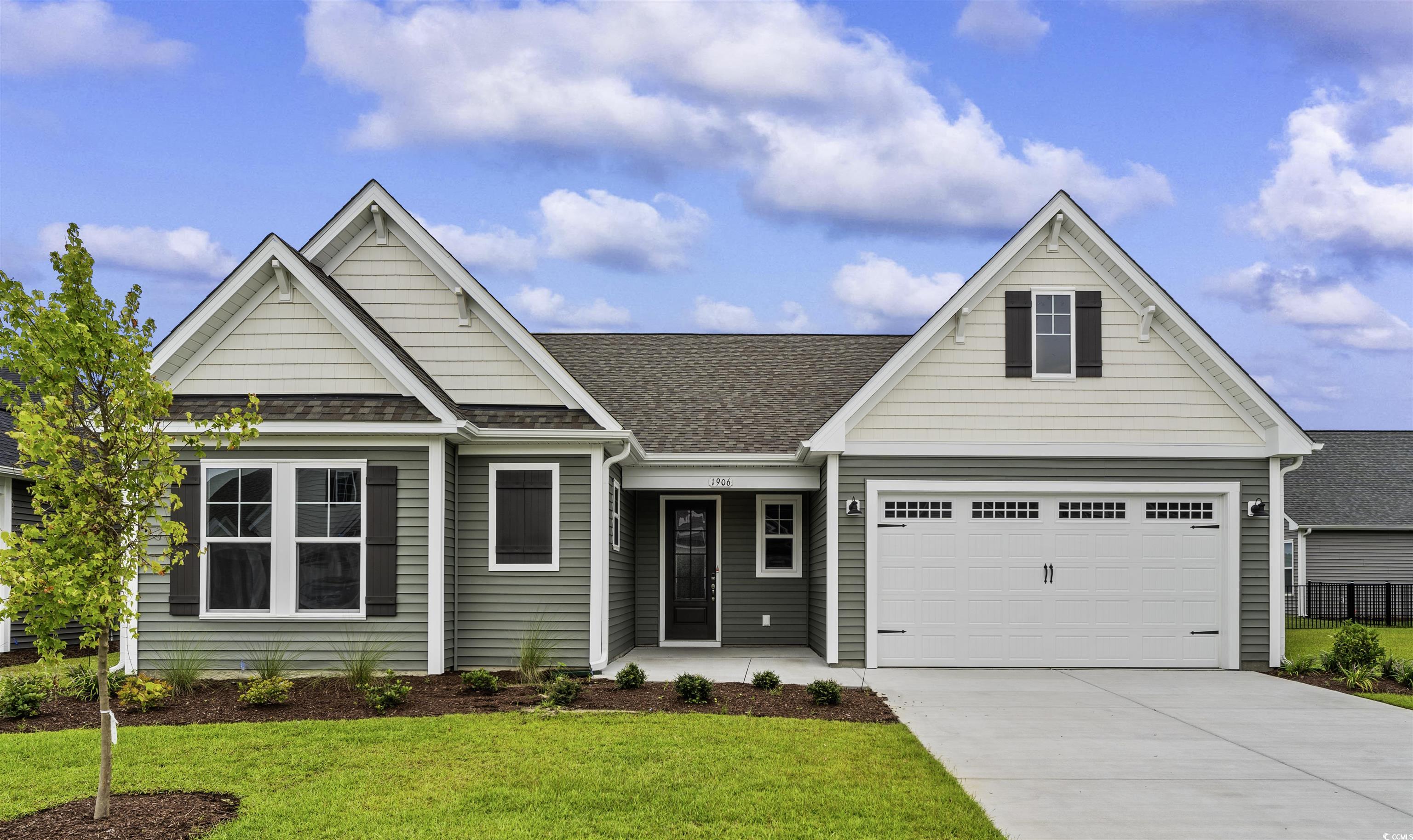 View of front of property with a front lawn