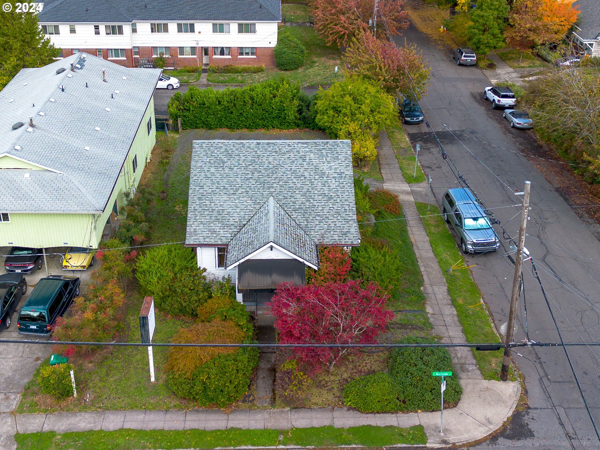 an aerial view of house with yard swimming pool and outdoor seating