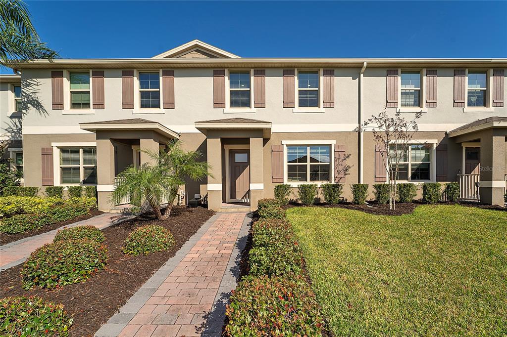 a front view of a house with a yard