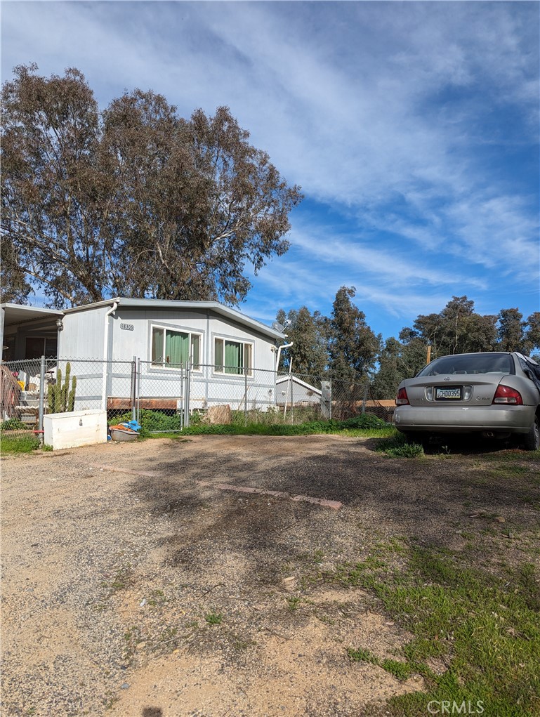 a view of a car parked in front of a house