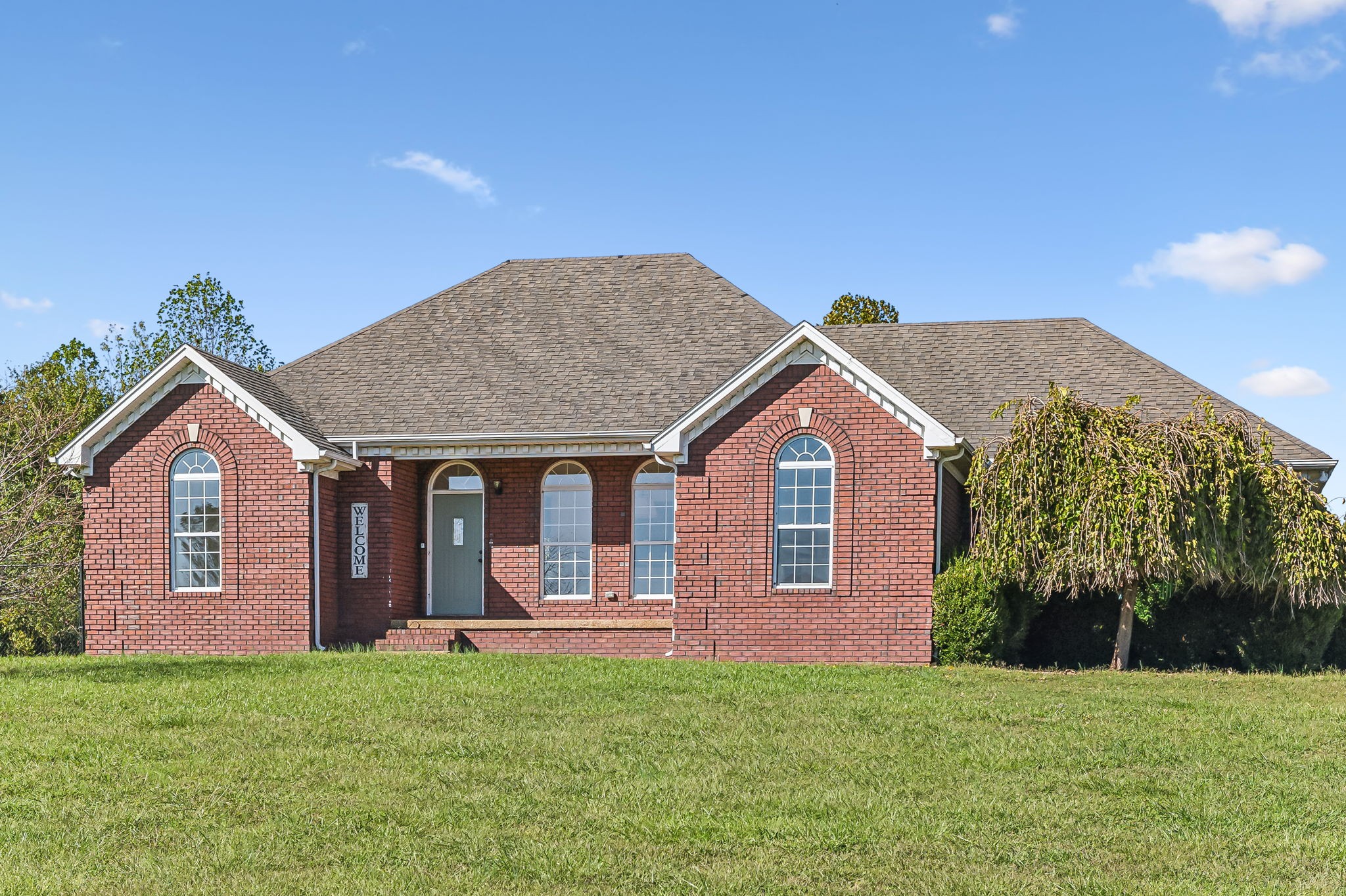 a front view of a house with garden