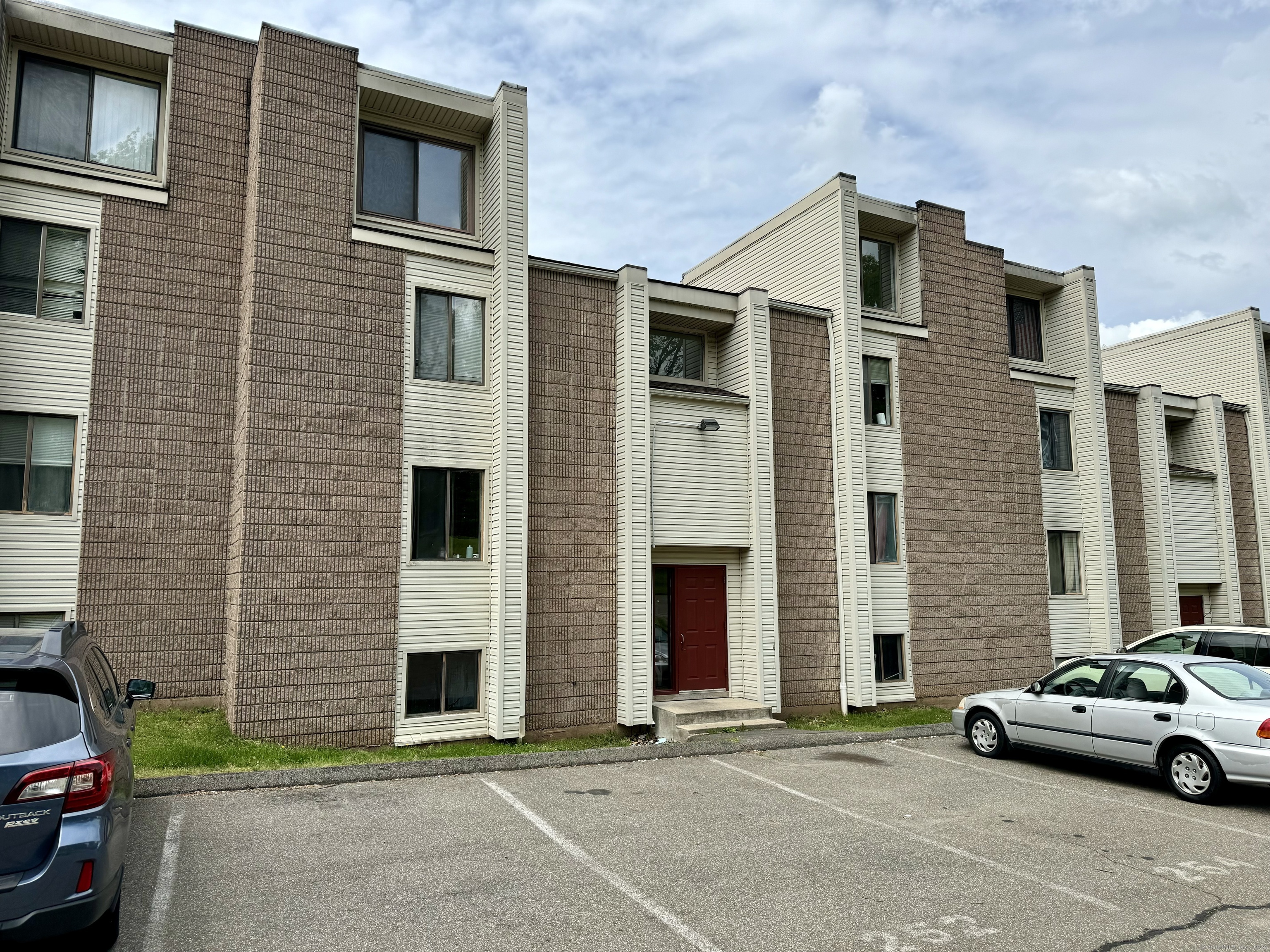 a front view of a house with parking space