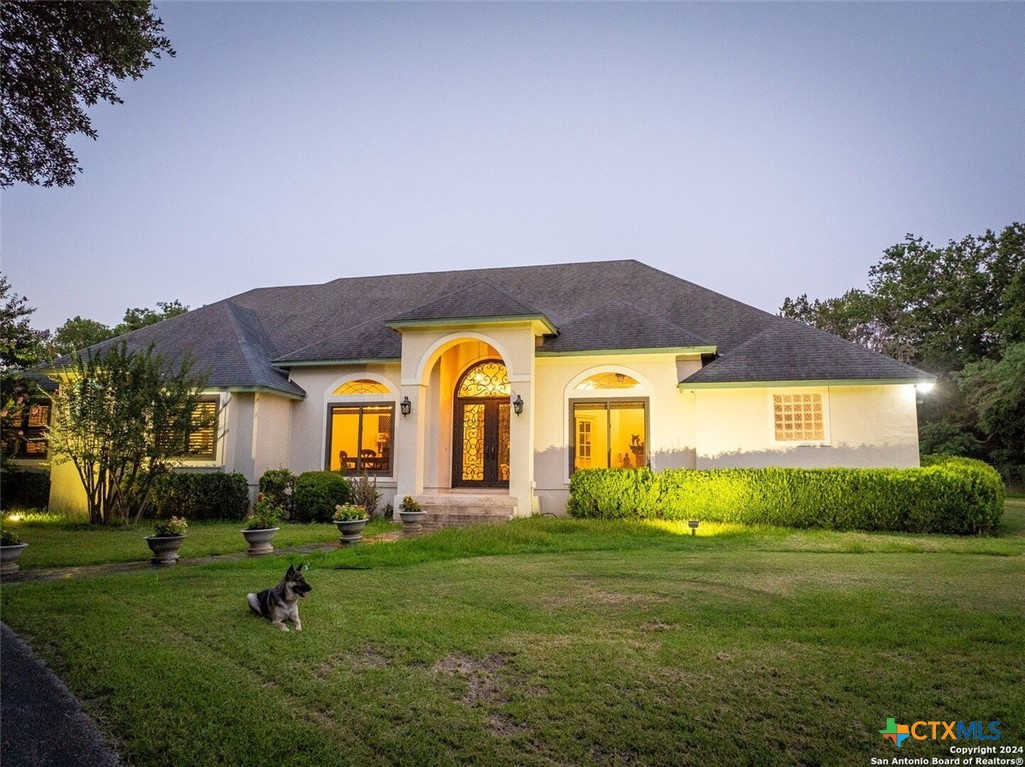 a front view of a house with garden