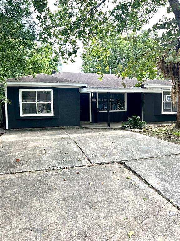 a house with trees in the background