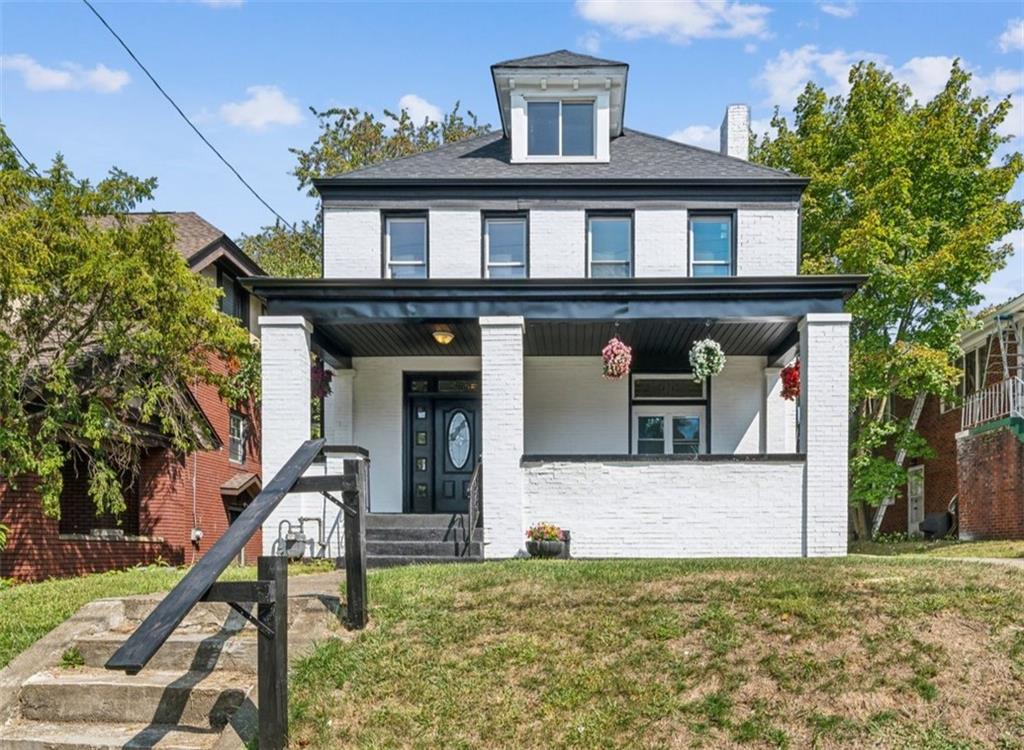 front view of a house with a yard