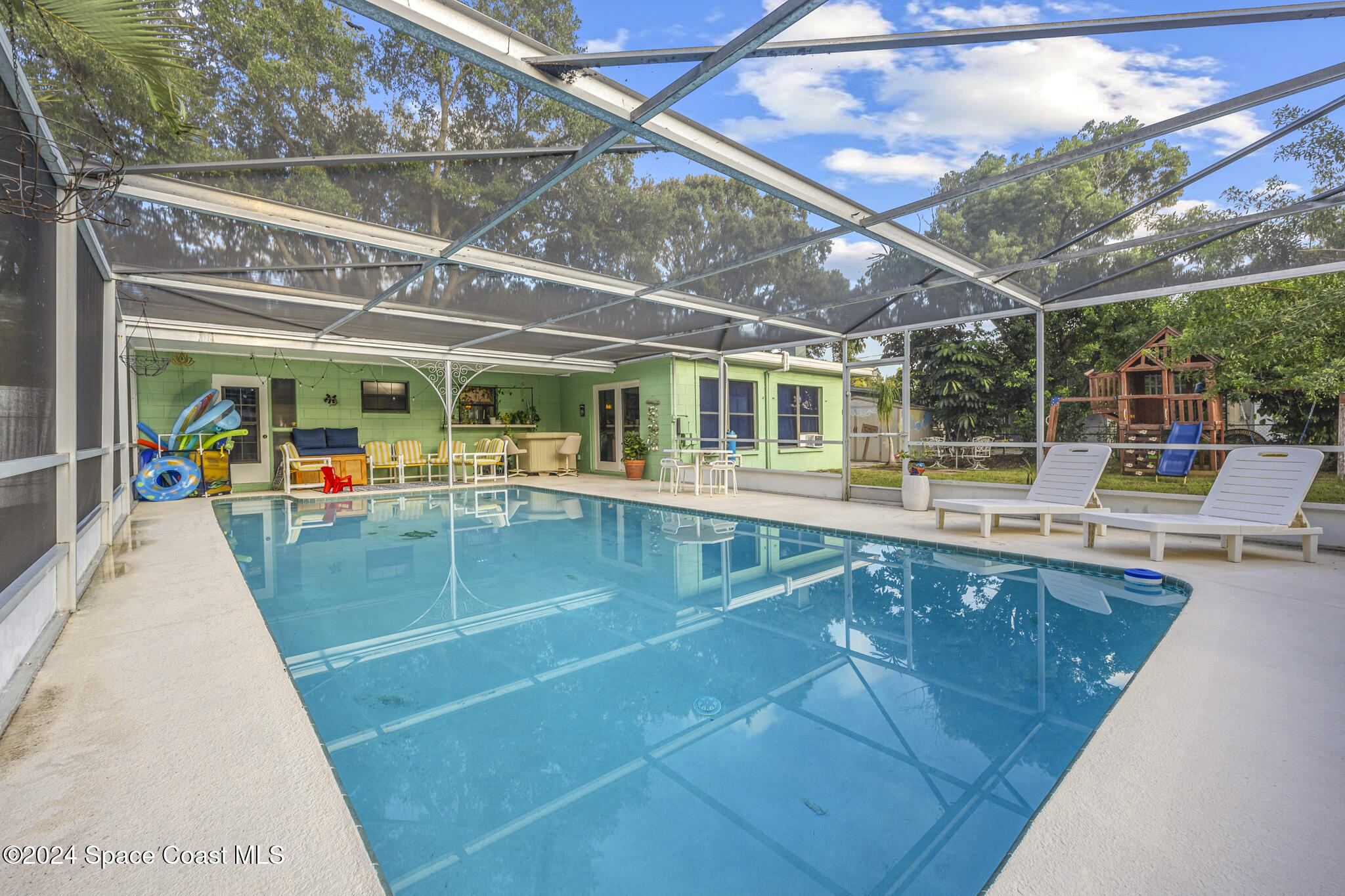 a view of a swimming pool with a patio