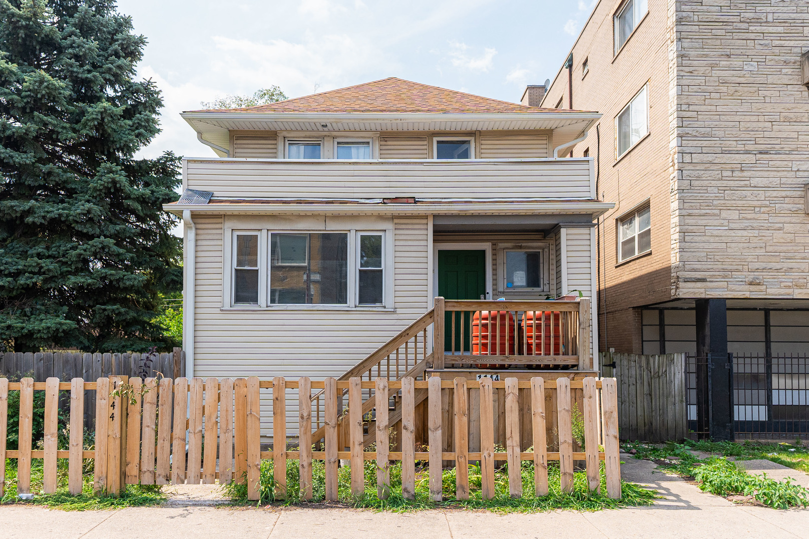 a front view of a house with a porch