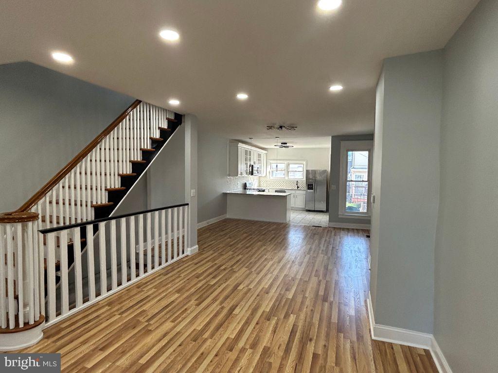 a view of a house and wooden floor