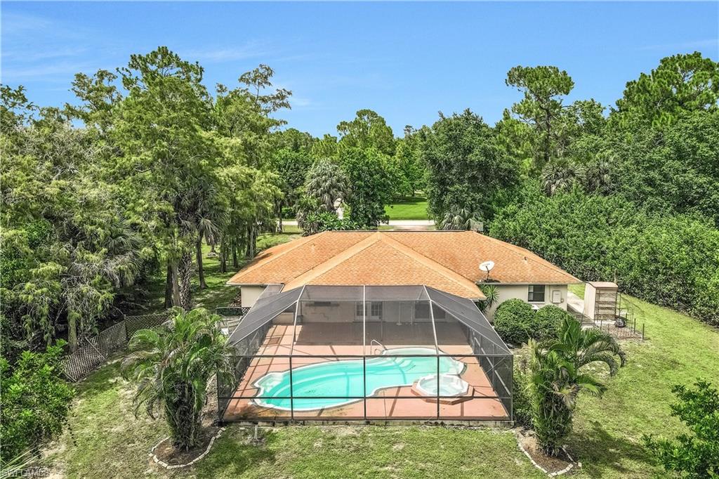 View of swimming pool with a yard