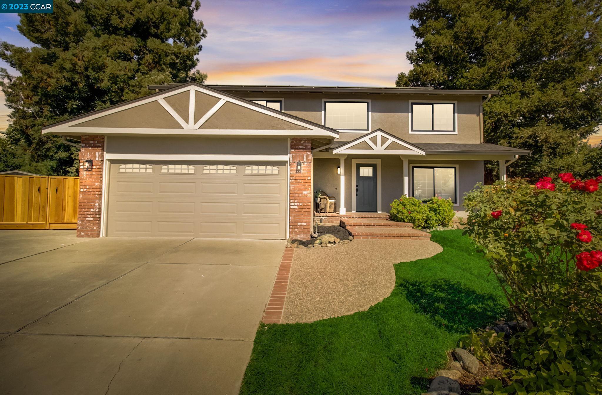 a front view of a house with yard