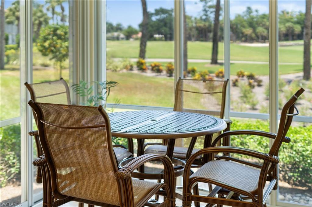 a view of a balcony with table and chairs