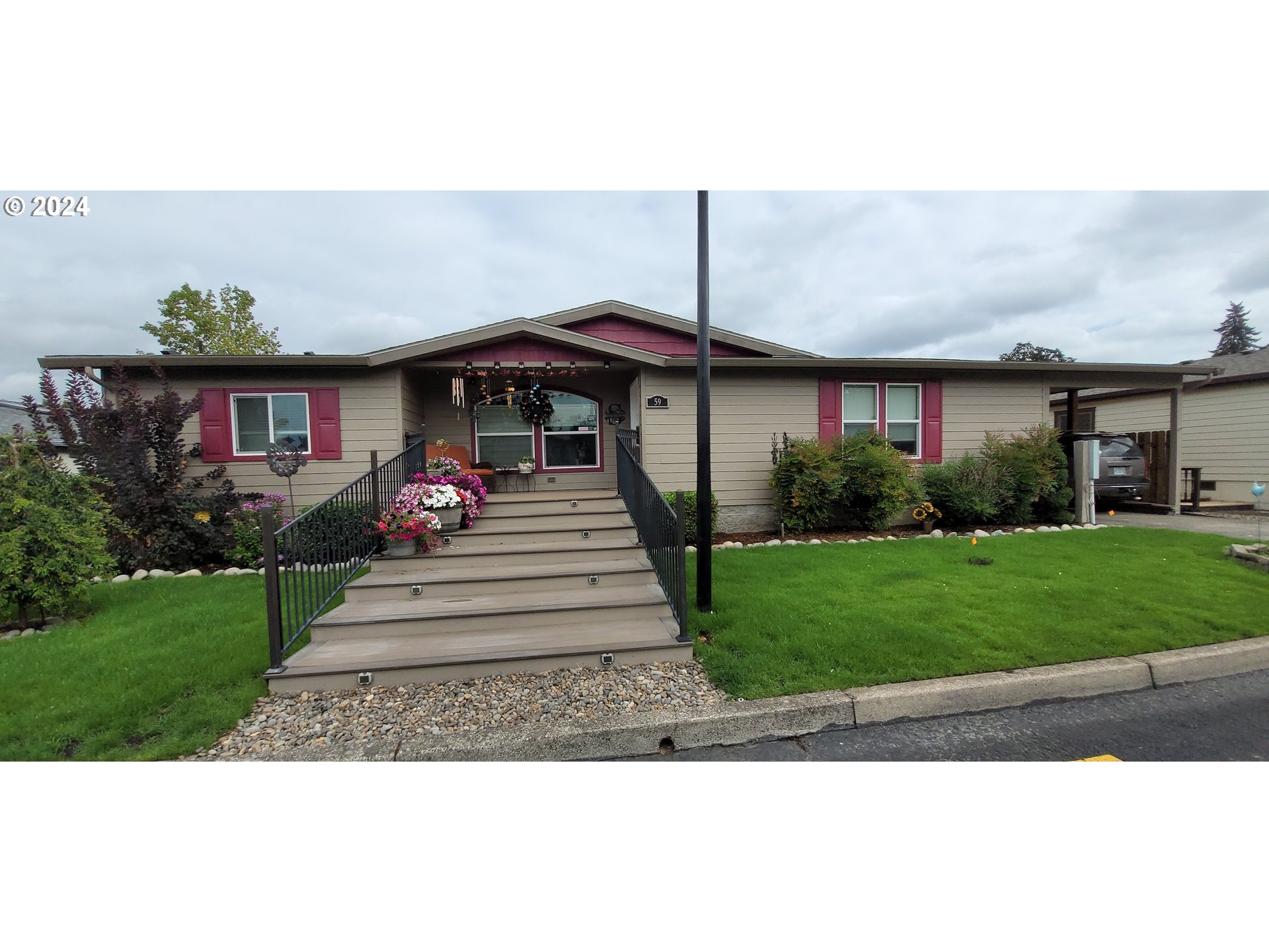 a front view of a house with garden