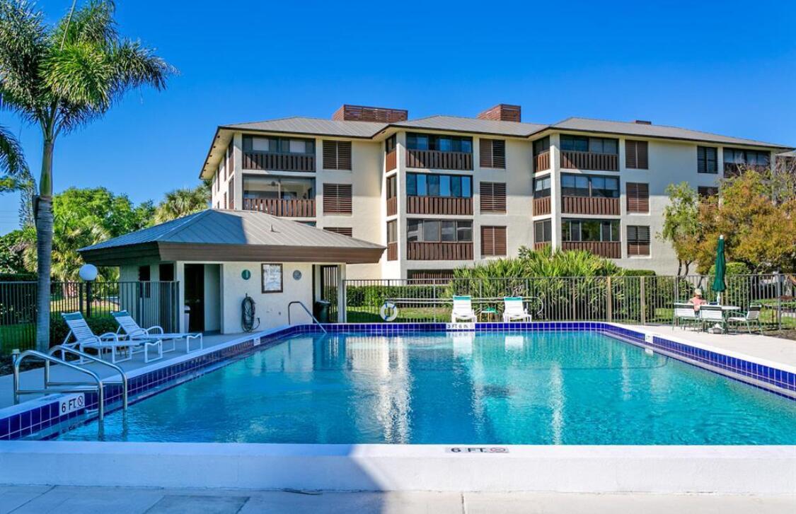 a swimming pool view with a garden space