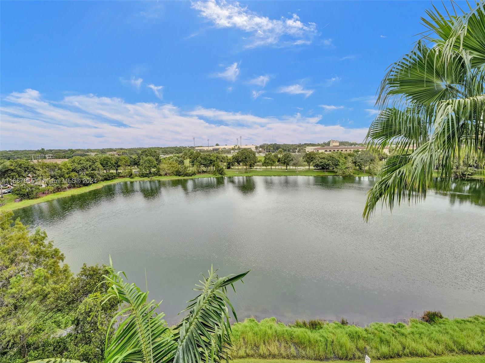 a view of a lake with houses in the back