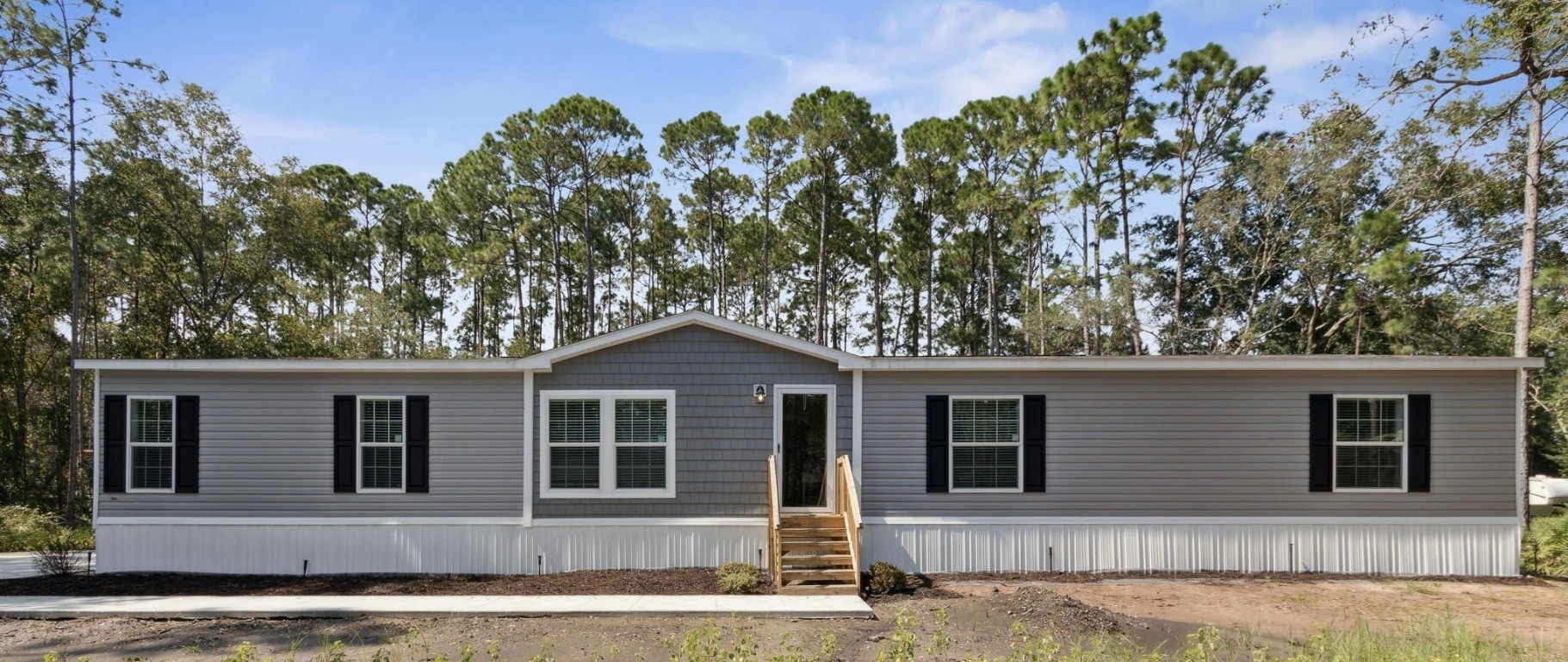 front view of a house with a yard