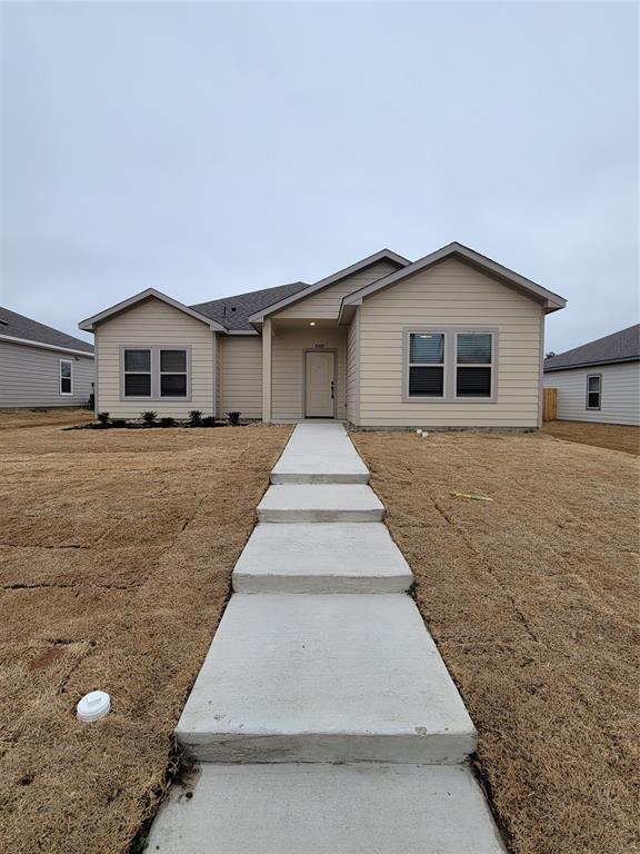 a front view of a house with yard