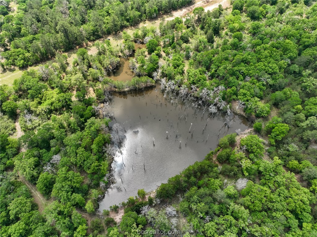 an aerial view of a houses with a yard