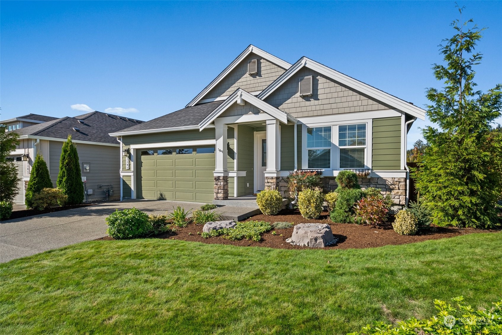 a front view of house with yard and green space