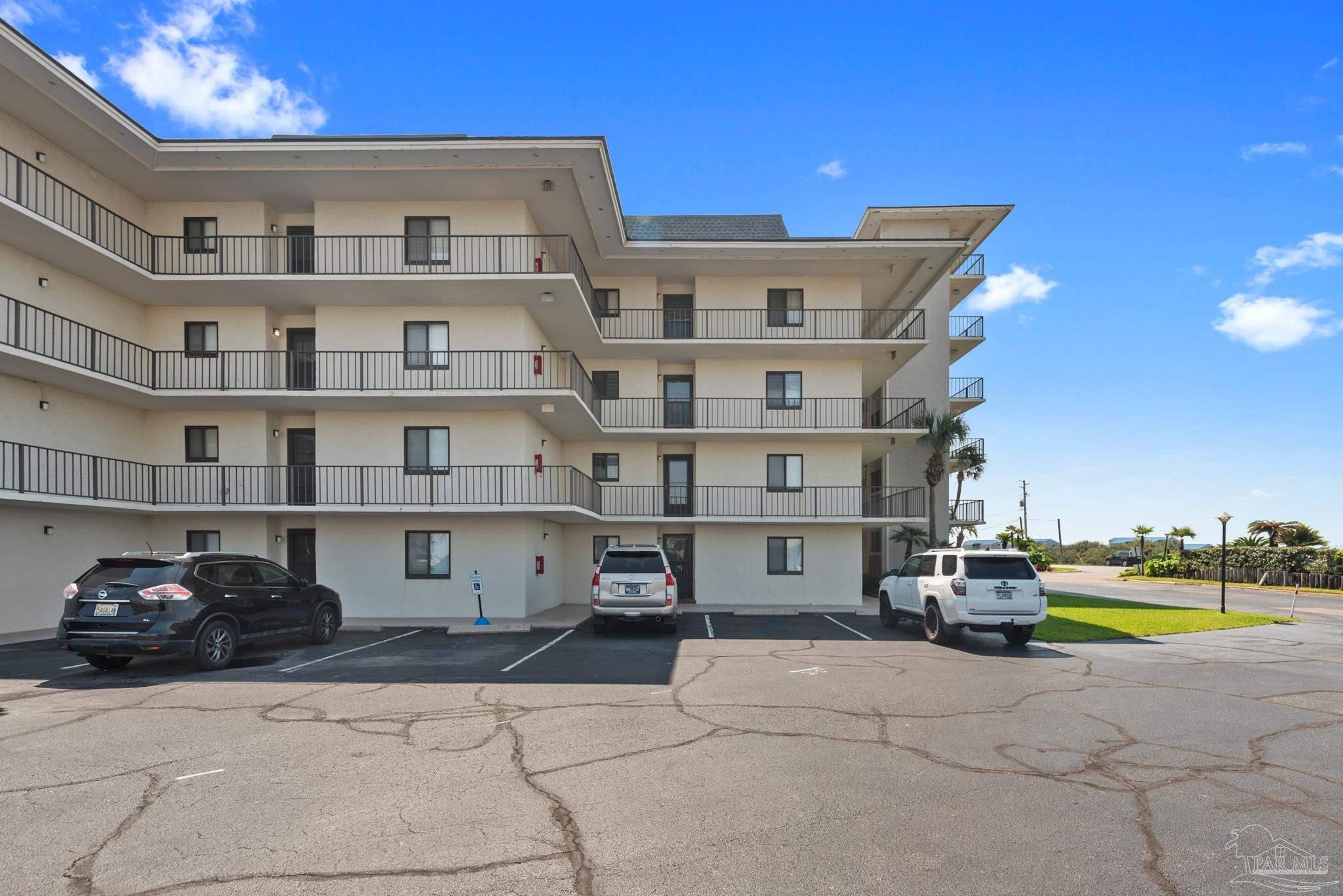 a view of a car park in front of house