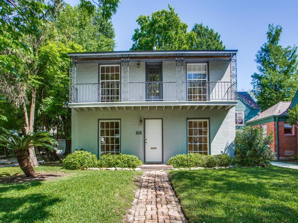 a house with a tree and a yard