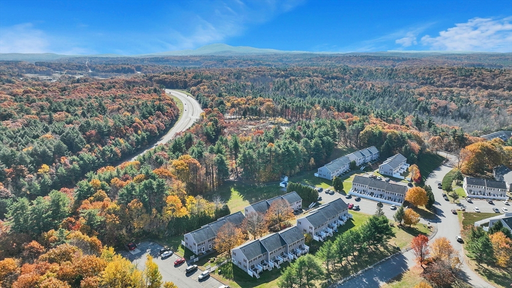 an aerial view of a house with a lake view