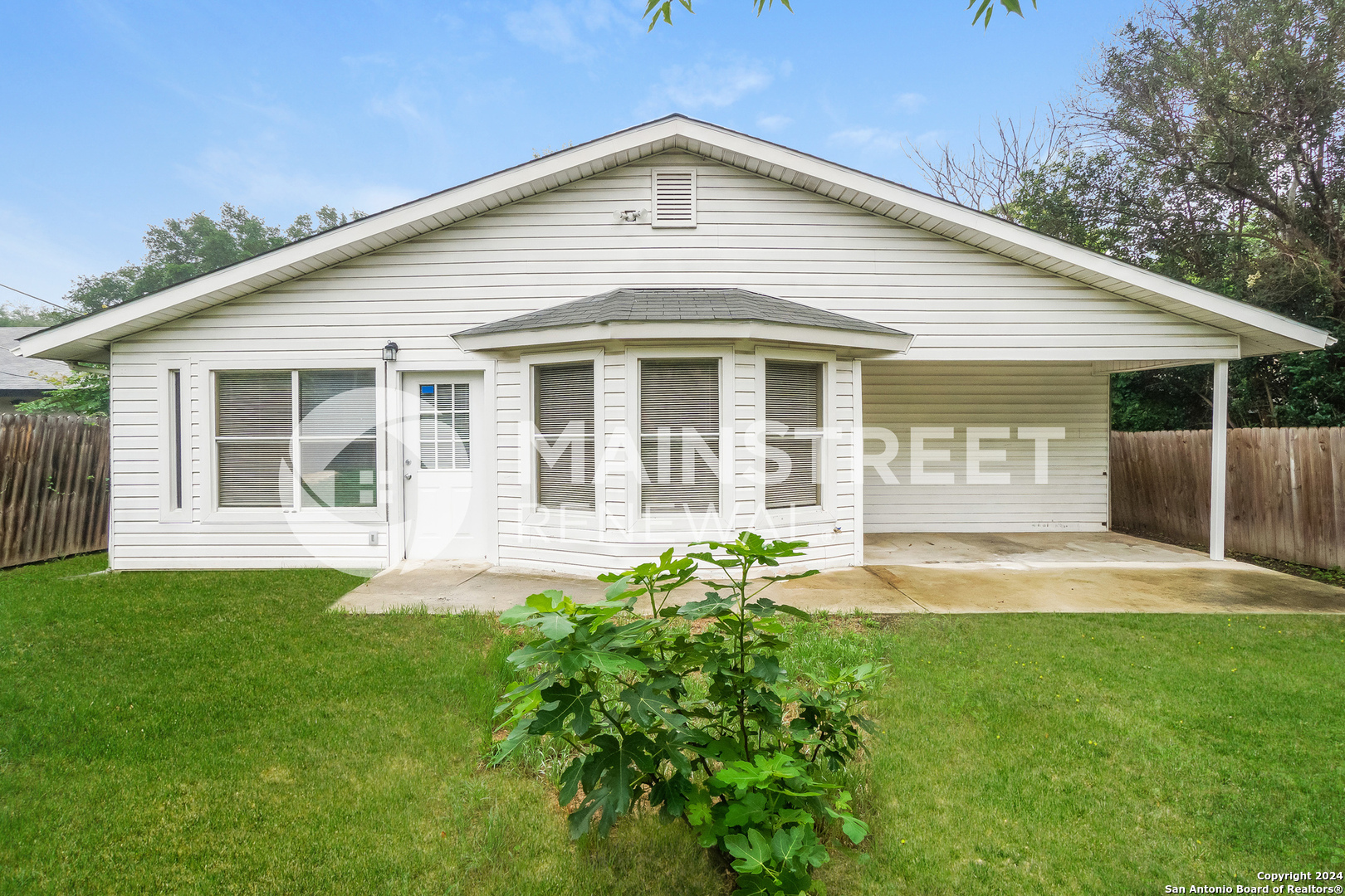 a front view of a house with a yard and porch