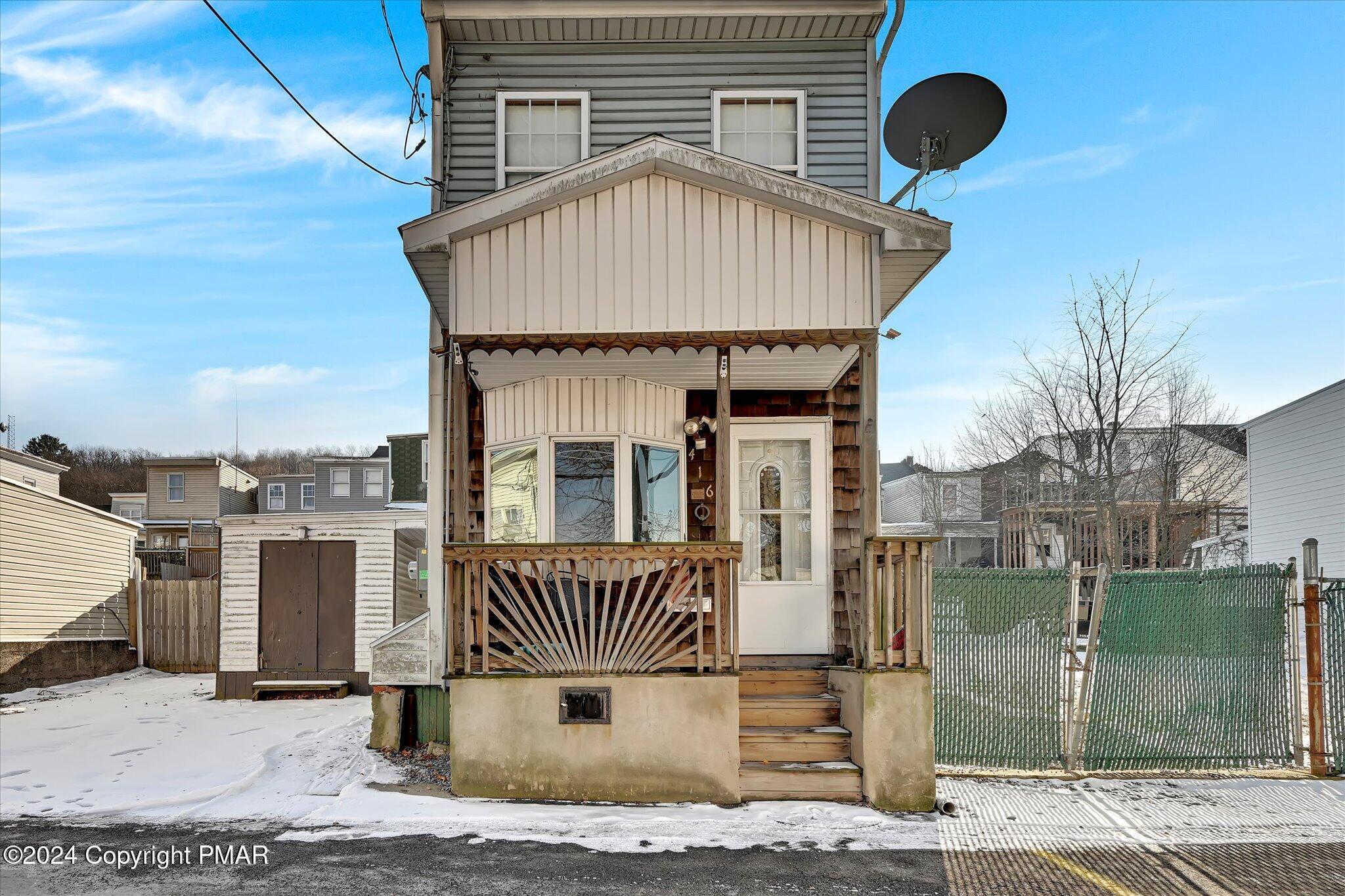 a view of a house with a roof deck