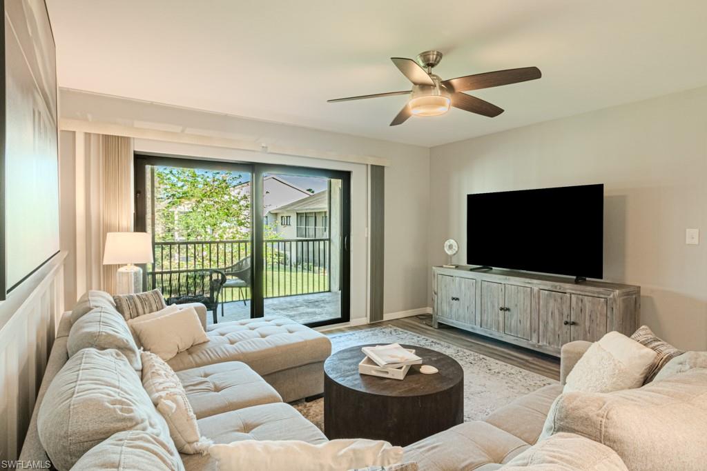 Living room featuring light hardwood / wood-style flooring and ceiling fan