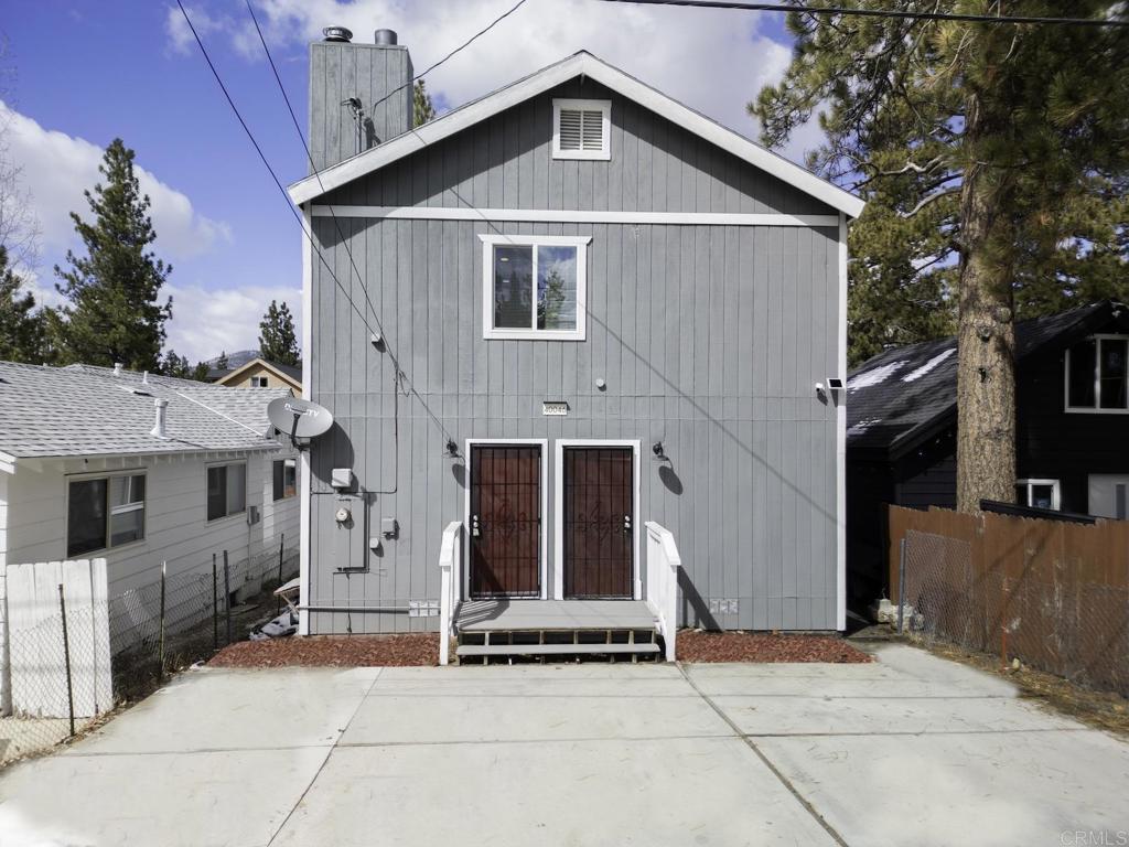 a front view of a house with garage